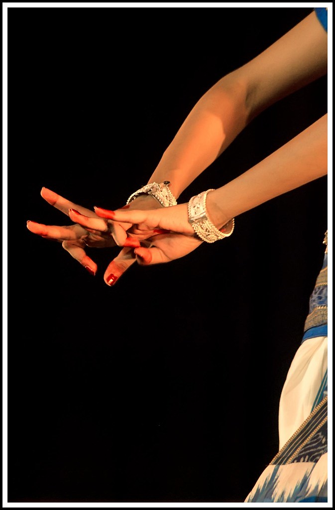 Expressive classical dance pose captured on stage