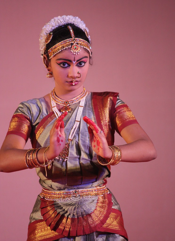 Bharatanatyam dancer in traditional costume holding a classical pose