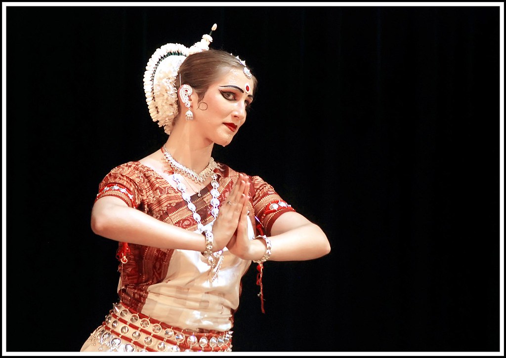 Group performing an expressive semi-classical Indian dance piece